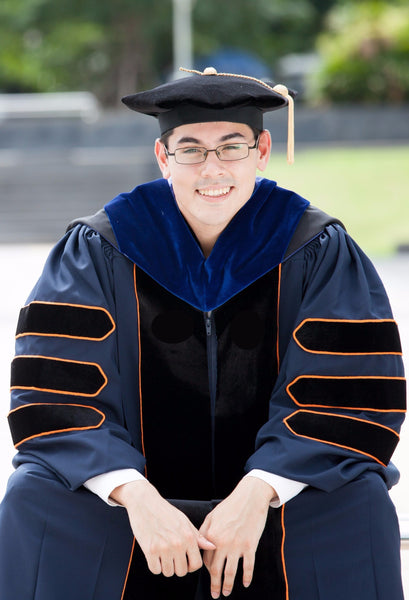UVA blue and orange PhD graduation gown, hood, tam